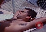 Image of men splashing swimming pool Las Vegas Nevada USA, 1967, second 27 stock footage video 65675079700