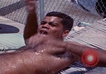 Image of men splashing swimming pool Las Vegas Nevada USA, 1967, second 28 stock footage video 65675079700