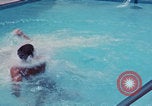 Image of men splashing swimming pool Las Vegas Nevada USA, 1967, second 33 stock footage video 65675079700