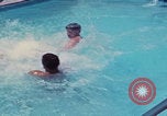 Image of men splashing swimming pool Las Vegas Nevada USA, 1967, second 34 stock footage video 65675079700
