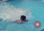 Image of men splashing swimming pool Las Vegas Nevada USA, 1967, second 35 stock footage video 65675079700