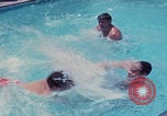 Image of men splashing swimming pool Las Vegas Nevada USA, 1967, second 36 stock footage video 65675079700