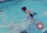 Image of men splashing swimming pool Las Vegas Nevada USA, 1967, second 37 stock footage video 65675079700