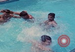 Image of men splashing swimming pool Las Vegas Nevada USA, 1967, second 38 stock footage video 65675079700