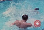 Image of men splashing swimming pool Las Vegas Nevada USA, 1967, second 39 stock footage video 65675079700