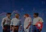 Image of tired men driving desert highway Las Vegas Nevada USA, 1967, second 13 stock footage video 65675079701