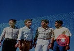 Image of tired men driving desert highway Las Vegas Nevada USA, 1967, second 18 stock footage video 65675079701