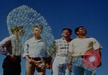 Image of tired men driving desert highway Las Vegas Nevada USA, 1967, second 22 stock footage video 65675079701