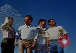 Image of tired men driving desert highway Las Vegas Nevada USA, 1967, second 23 stock footage video 65675079701