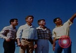 Image of tired men driving desert highway Las Vegas Nevada USA, 1967, second 24 stock footage video 65675079701