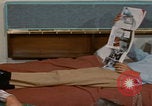 Image of tired men driving desert highway Las Vegas Nevada USA, 1967, second 40 stock footage video 65675079701