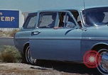 Image of flat tire desert driving United States USA, 1967, second 5 stock footage video 65675079702