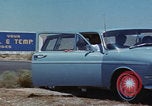 Image of flat tire desert driving United States USA, 1967, second 6 stock footage video 65675079702