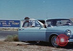 Image of flat tire desert driving United States USA, 1967, second 7 stock footage video 65675079702