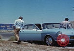 Image of flat tire desert driving United States USA, 1967, second 9 stock footage video 65675079702
