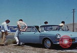 Image of flat tire desert driving United States USA, 1967, second 12 stock footage video 65675079702