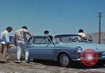 Image of flat tire desert driving United States USA, 1967, second 13 stock footage video 65675079702