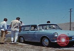 Image of flat tire desert driving United States USA, 1967, second 14 stock footage video 65675079702