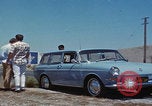 Image of flat tire desert driving United States USA, 1967, second 16 stock footage video 65675079702