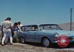 Image of flat tire desert driving United States USA, 1967, second 17 stock footage video 65675079702