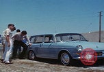 Image of flat tire desert driving United States USA, 1967, second 18 stock footage video 65675079702
