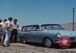 Image of flat tire desert driving United States USA, 1967, second 21 stock footage video 65675079702