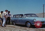 Image of flat tire desert driving United States USA, 1967, second 22 stock footage video 65675079702