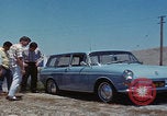 Image of flat tire desert driving United States USA, 1967, second 23 stock footage video 65675079702