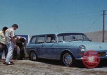 Image of flat tire desert driving United States USA, 1967, second 24 stock footage video 65675079702