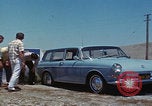 Image of flat tire desert driving United States USA, 1967, second 25 stock footage video 65675079702