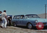 Image of flat tire desert driving United States USA, 1967, second 26 stock footage video 65675079702