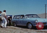 Image of flat tire desert driving United States USA, 1967, second 27 stock footage video 65675079702