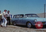Image of flat tire desert driving United States USA, 1967, second 29 stock footage video 65675079702
