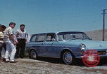 Image of flat tire desert driving United States USA, 1967, second 30 stock footage video 65675079702
