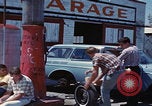 Image of flat tire desert driving United States USA, 1967, second 47 stock footage video 65675079702