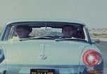 Image of flat tire desert driving United States USA, 1967, second 62 stock footage video 65675079702