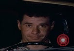 Image of man falling asleep driving San Bernardino California USA, 1967, second 28 stock footage video 65675079704