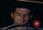 Image of man falling asleep driving San Bernardino California USA, 1967, second 58 stock footage video 65675079704