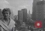 Image of couple in formal 60s fashions New York City USA, 1960, second 7 stock footage video 65675079724