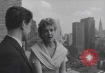 Image of couple in formal 60s fashions New York City USA, 1960, second 14 stock footage video 65675079724
