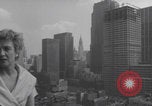 Image of couple in formal 60s fashions New York City USA, 1960, second 33 stock footage video 65675079724