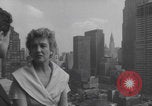 Image of couple in formal 60s fashions New York City USA, 1960, second 34 stock footage video 65675079724