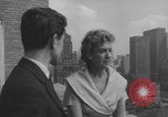 Image of couple in formal 60s fashions New York City USA, 1960, second 36 stock footage video 65675079724