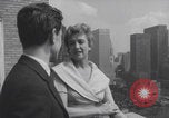 Image of couple in formal 60s fashions New York City USA, 1960, second 42 stock footage video 65675079724