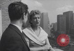Image of couple in formal 60s fashions New York City USA, 1960, second 43 stock footage video 65675079724