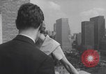 Image of couple in formal 60s fashions New York City USA, 1960, second 44 stock footage video 65675079724