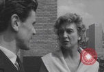 Image of couple in formal 60s fashions New York City USA, 1960, second 54 stock footage video 65675079724