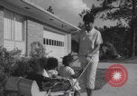 Image of African American suburban mother with children Atlanta Georgia USA, 1960, second 32 stock footage video 65675079731