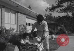 Image of African American suburban mother with children Atlanta Georgia USA, 1960, second 35 stock footage video 65675079731