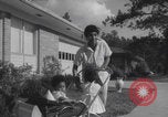 Image of African American suburban mother with children Atlanta Georgia USA, 1960, second 37 stock footage video 65675079731